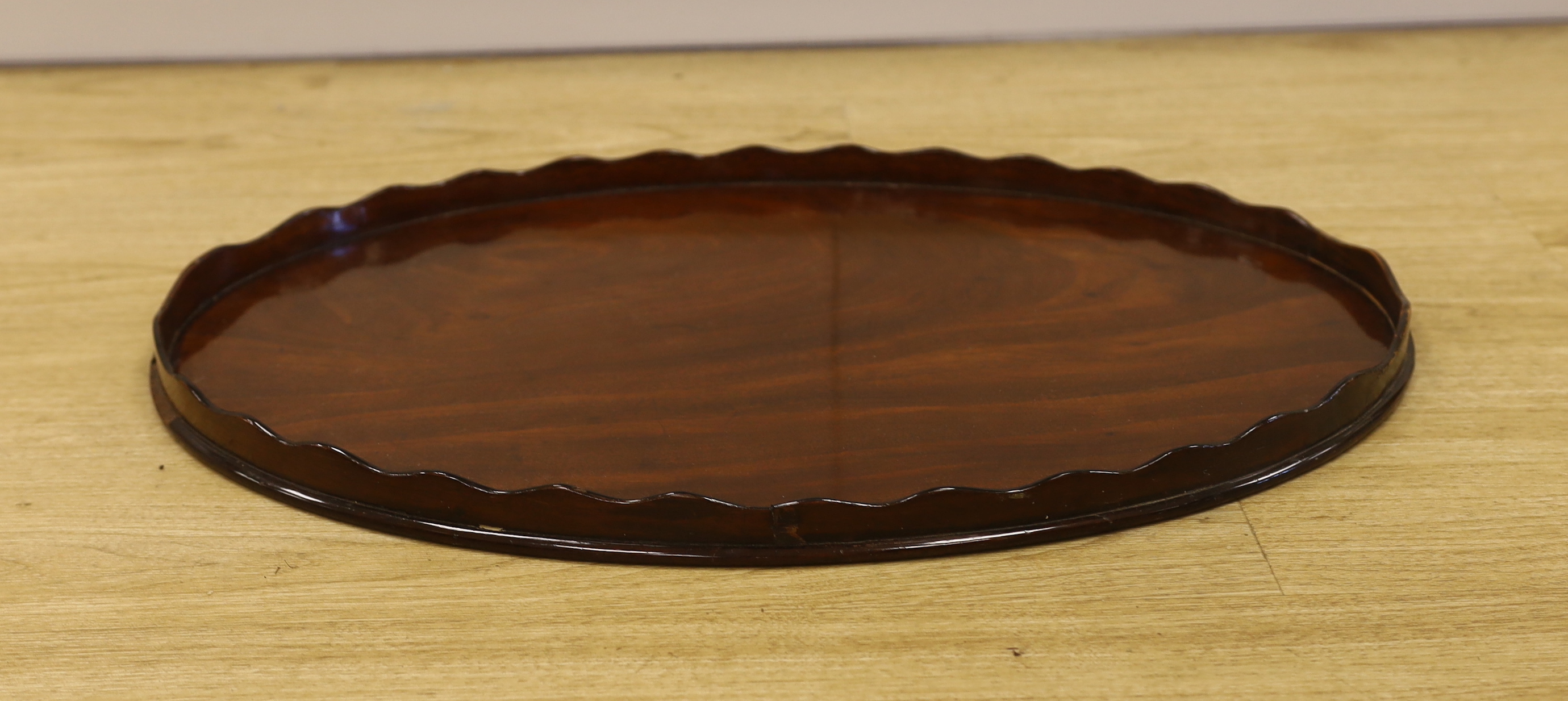 A George III mahogany oval galleried tray, 65cm wide